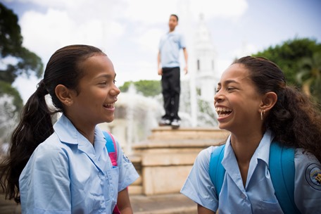 two school girls smiling