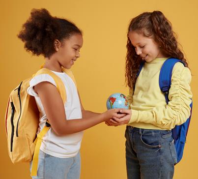 two students with a globe