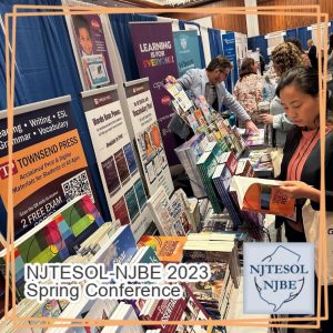 Attendees looking at exhibitors&#039; books