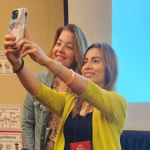 2 presenters taking a selfie