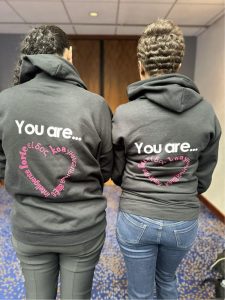 2 teachers with matching hoodies