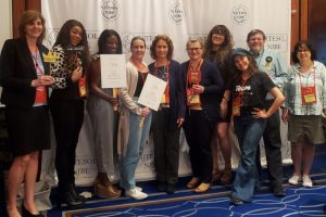 10 teachers in front of the selfie station