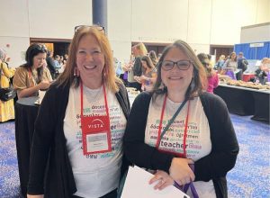 2 teachers with matching t-shirts