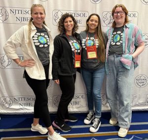 4 teachers with t-shirts