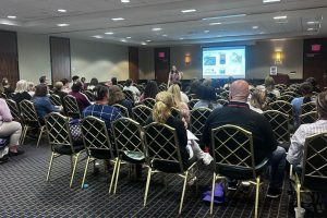 attendees listening to a presentation