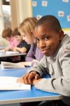 student reading-writing in class