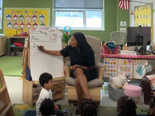 a teacher with young students